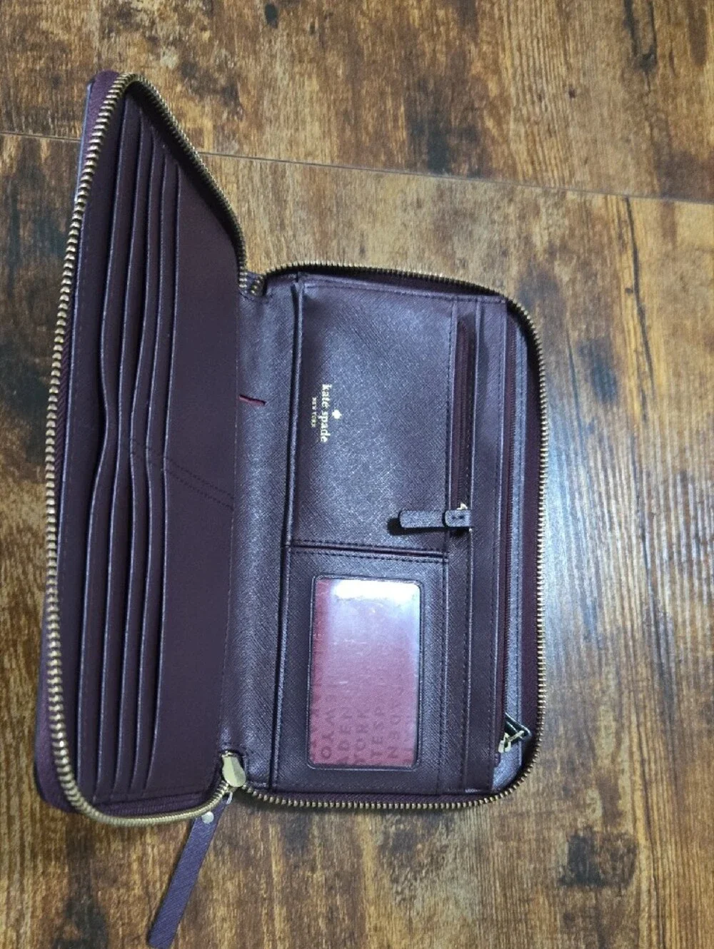 kate spade deep plum Saffiano zip-around leather wallet